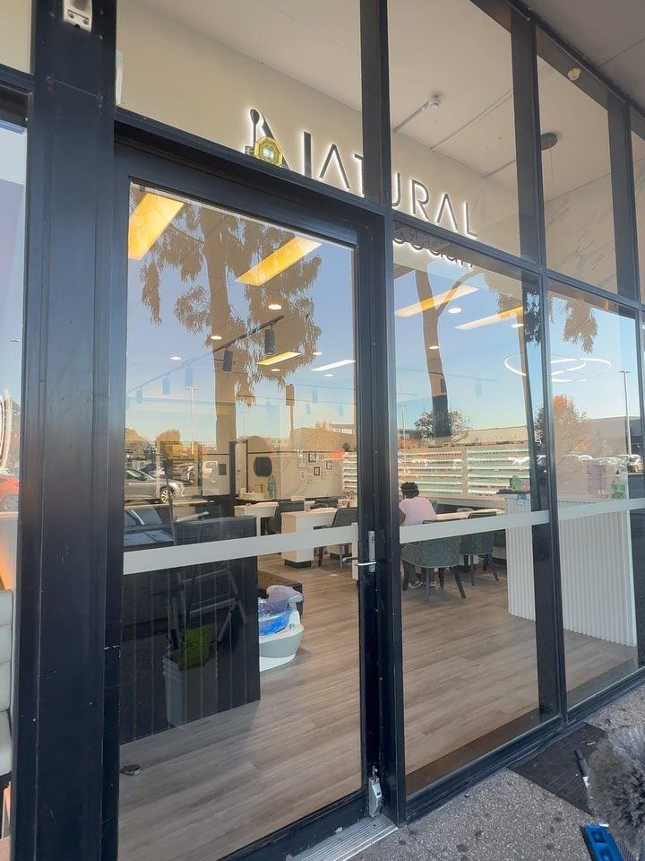 Clean floor-to-ceiling glass at a Melbourne cafe